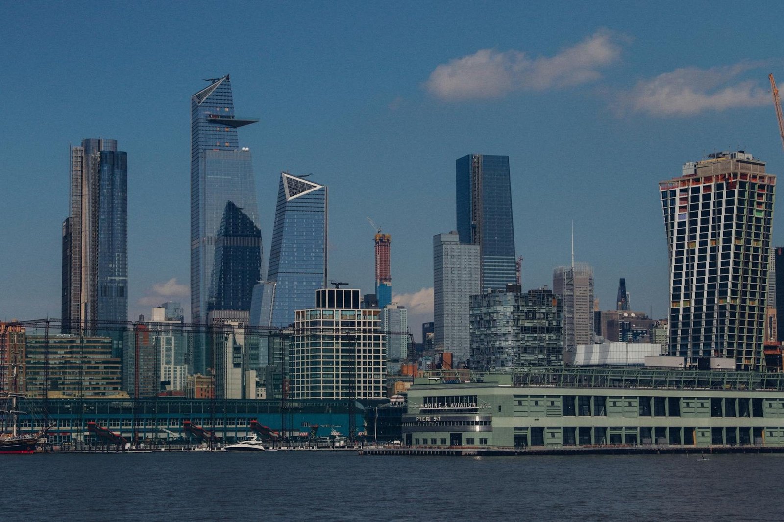 New York City Hudson Yards skyline from Hudson River, featuring 30 Hudson Yards and Pier 57.