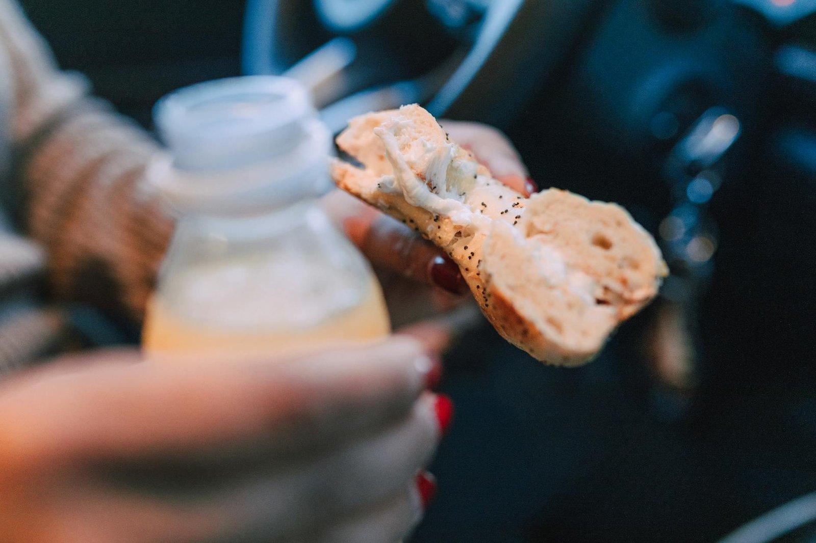 NYC bagel with cream cheese and juice, a classic New York breakfast on the go.