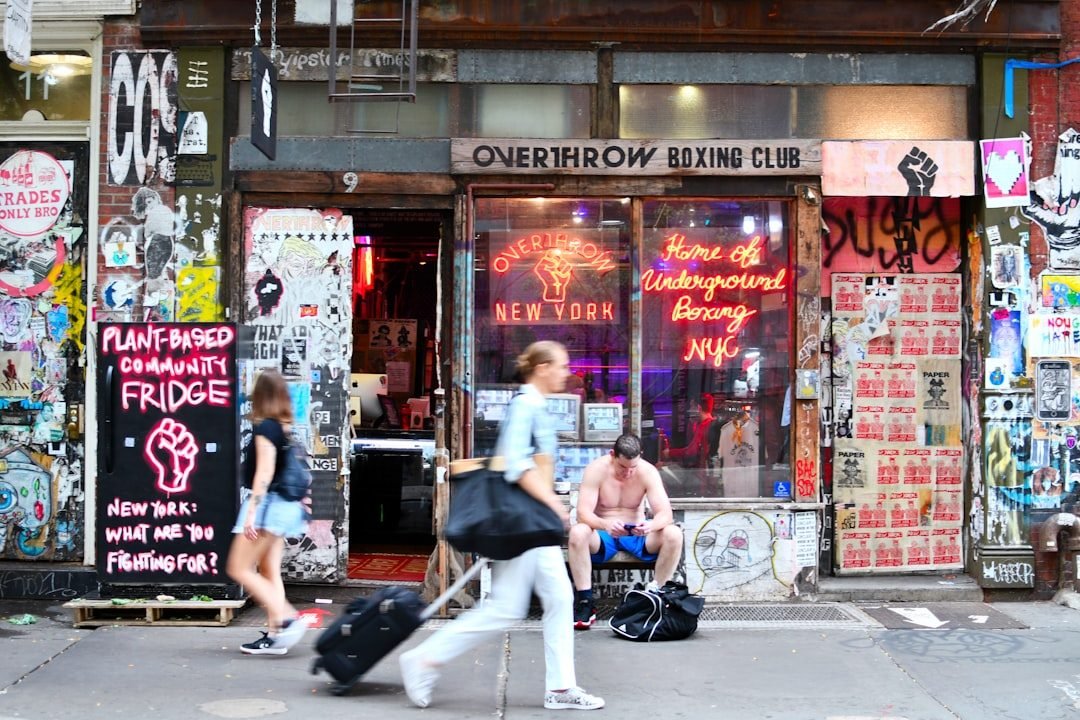 Overthrow Boxing Club, Lower East Side, NYC street art, neon signs, urban life.